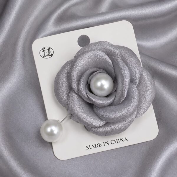 Ash colored brooch with pearl can be used for hijabs and for sarees
